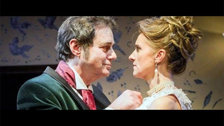 Paul Herzberg with a woman in period clothes